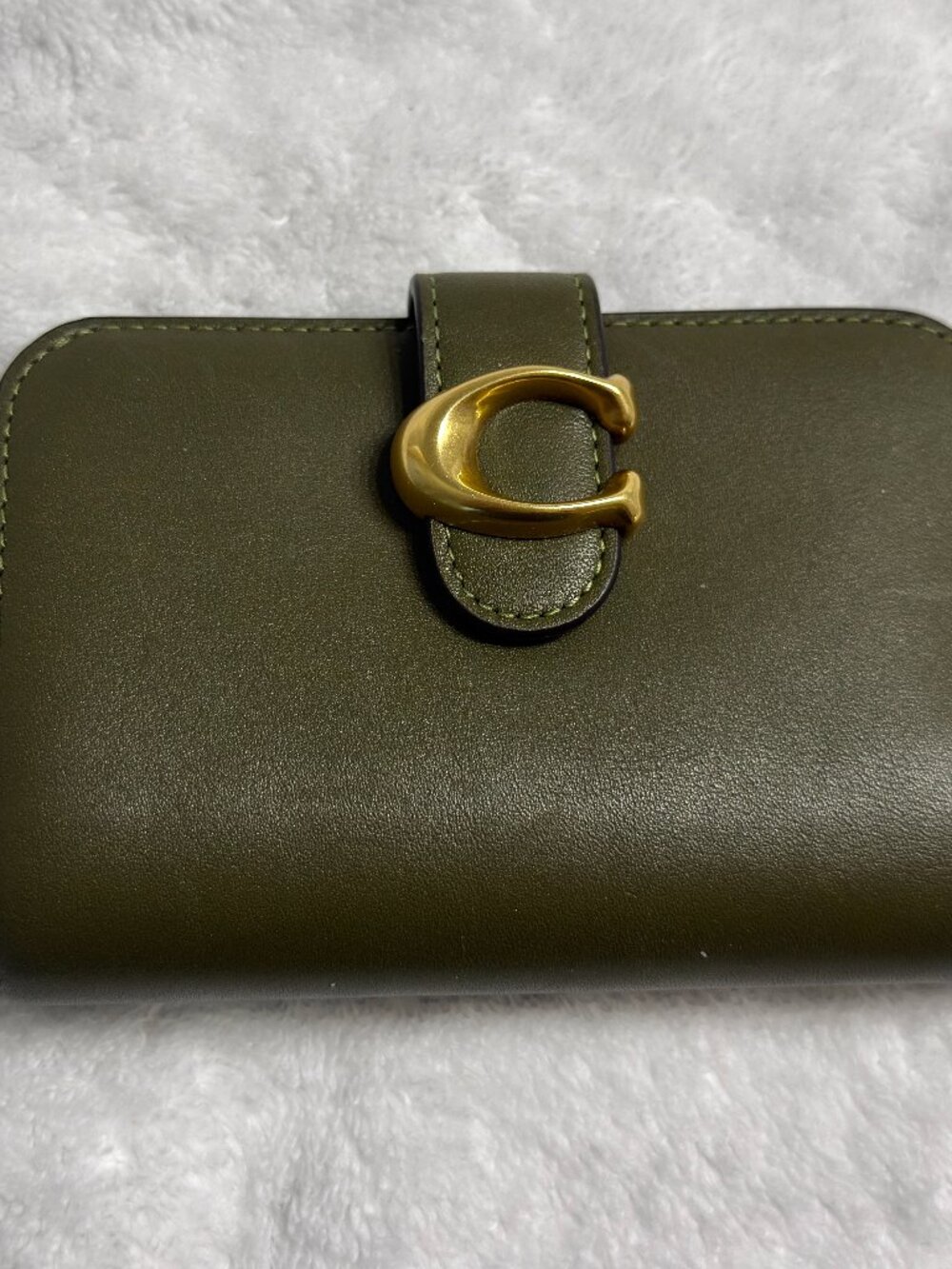 Very good used condition. Coach Tabby Wallet. Olive green- no longer sold.